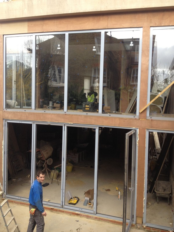 Aluminium bi-fold doors with two-storey glazing in Bethnal Green