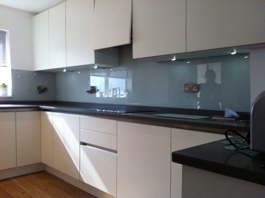 Grey glass kitchen splashback with LED lighting in Bethnal Green